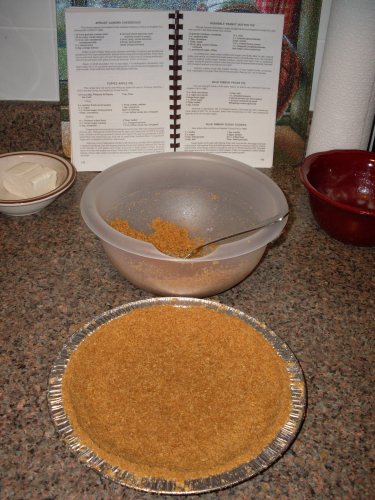 pressing crust into tins