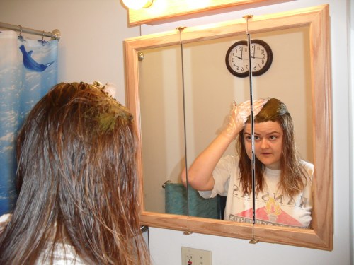 applying henna with hands